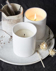 The Floral Society Juniper & Geranium Candle lifestyle shot with other items (not included)