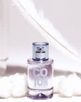 Solinotes Paris Cotton Eau de Parfum (50 ml) beauty shot pictured with cotton balls and a white feather in background