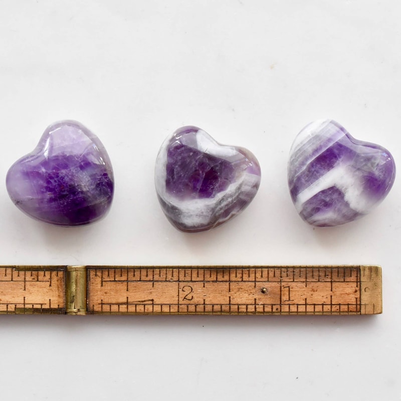Open Heart Apothecary Amethyst Heart Crystal three stones pictured with ruler to show size