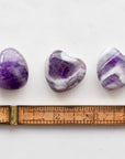 Open Heart Apothecary Amethyst Heart Crystal three stones pictured with ruler to show size
