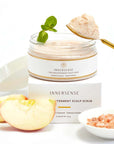 Beauty shot of Innersense True Enlightenment Scalp Scrub (190 g) with box gold spoon with scrub and ingredients in the background