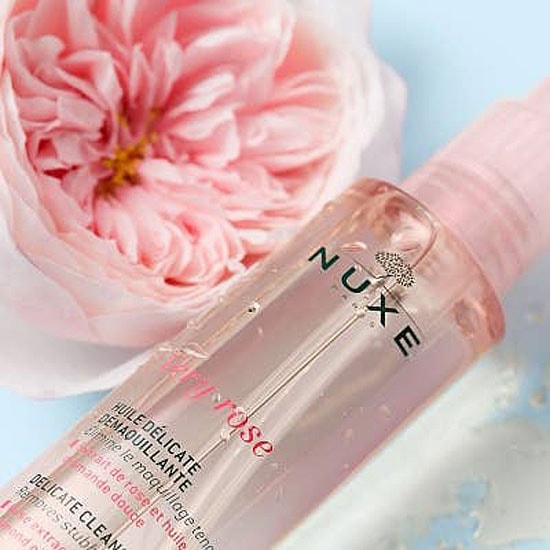 Nuxe Very Rose Delicate Cleansing Oil bottle close-up with rose