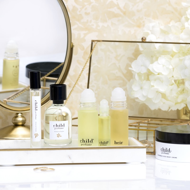 Lifestyle shot of Child Perfumes on a dresser (each sold separately)