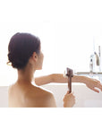 Shaquda SUVE Body Brush Long Lifestyle shot - model using brush in bath