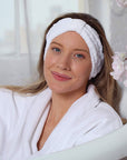 Daily Concepts Daily Beauty Headband on model's head while she sits in bathtub in a robe