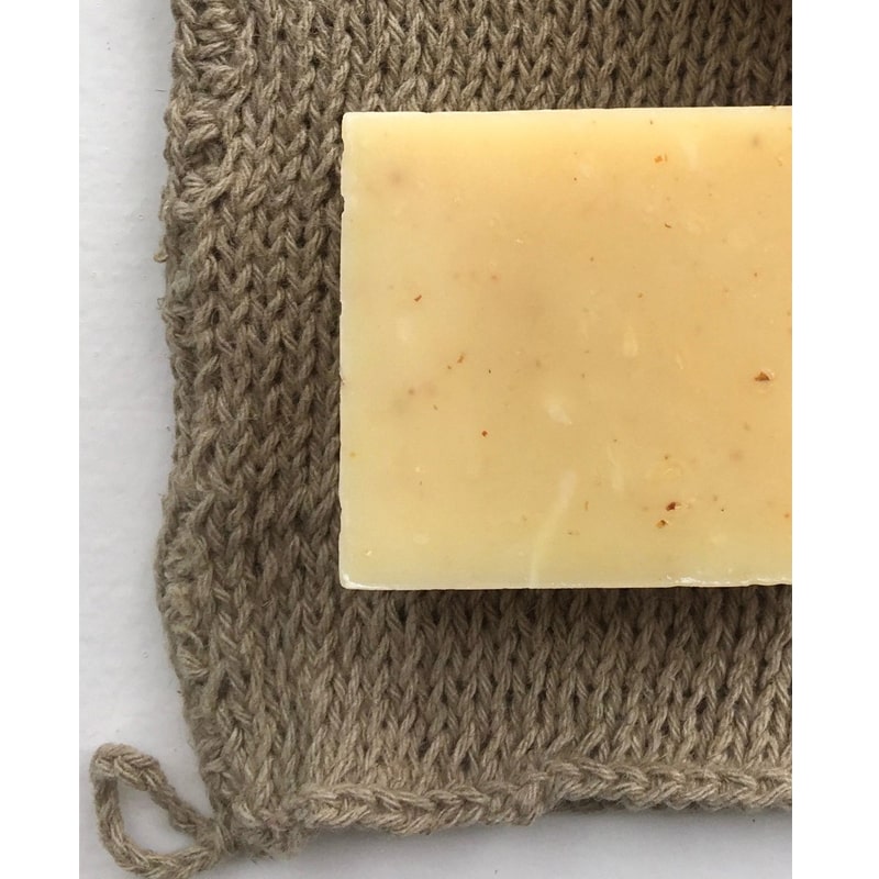 Fog Linen Work Linen Knit Wash Cloth pictured with bar of soap and close-up of knit weave. (soap not included)