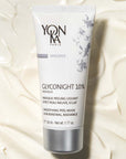 Yon-Ka Paris Glyconight 10% Masque (50 ml) lifestyle shot with masque texture in the background