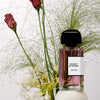 BDK Parfums Bouquet de Hongrie Eau de Parfum pictured with flowers and greenery (not included)