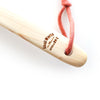 Shoji Works Long Handle Body Brush - close-up of brand imprint on handle