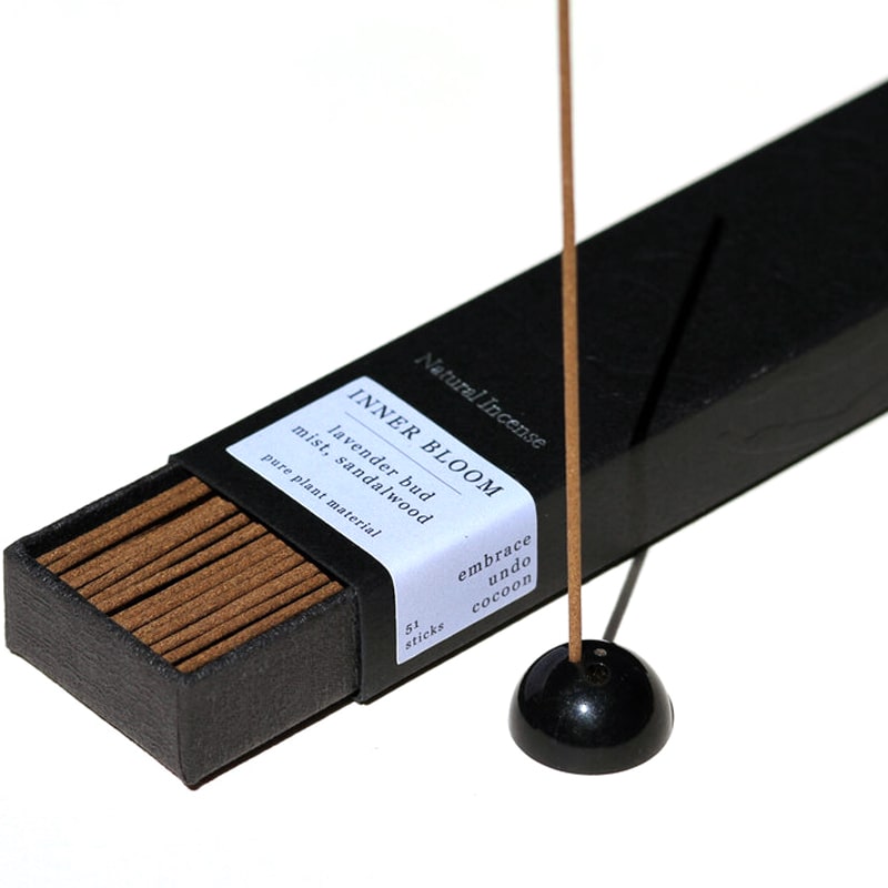 Ume Incense Inner Bloom Incense shown inserted into an incense burner (sold separately)