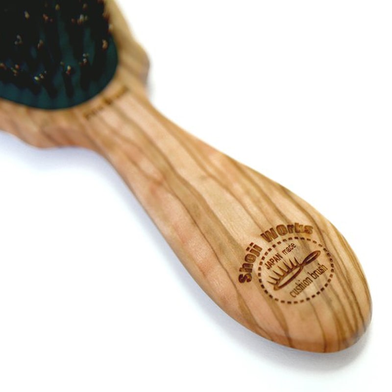 Shoji Works Olive Wood Cushion Hairbrush - showing close-up of handle