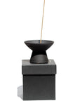 Ume Incense Shibui Raw Black Stoneware Incense Holder side view on box with stick incense (not included)