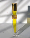 Bohemian Reves Sol Dorado Botanical Perfume Roller (12.5 ml) - beauty shot with fragrance in shadows