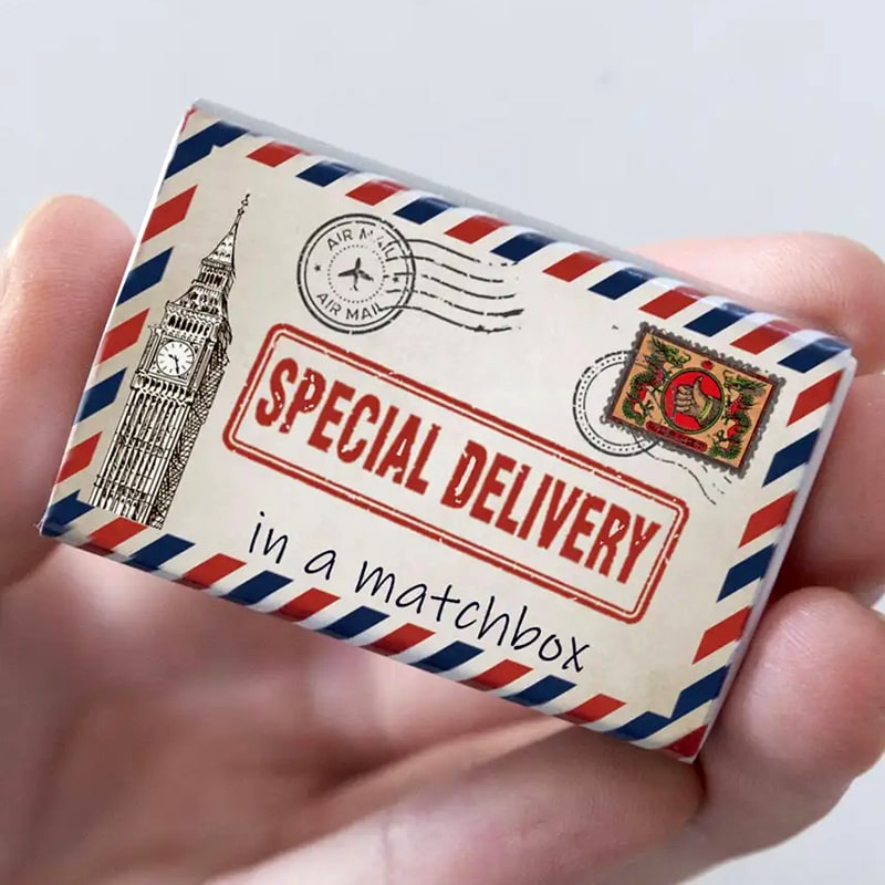 Marvling Bros Ltd Special Delivery Happy Birthday Mini Bouquet showing closed matchbox in model&#39;s hand.
