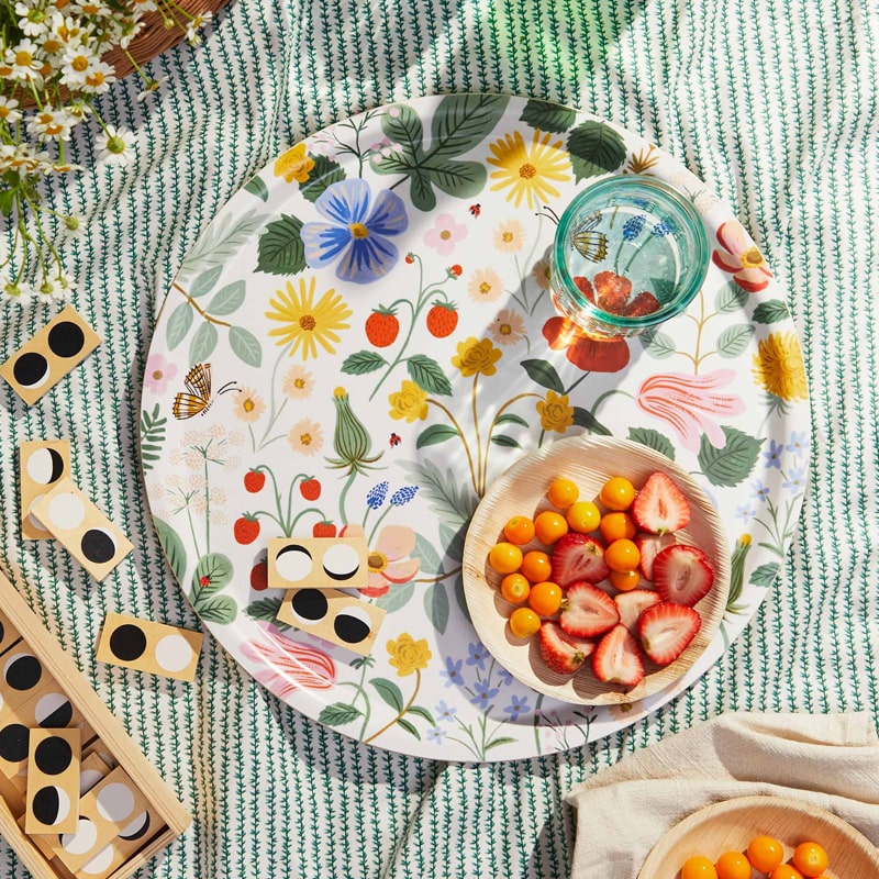 Rifle Paper Co Strawberry Field Plywood Round Tray - lifestyle shot showing bowl of fruit and glass on tray