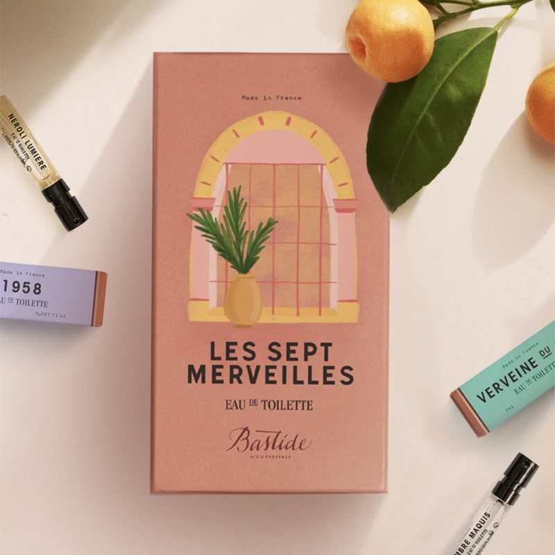 Bastide Les Sept Merveilles Fragrance Discovery Set lifestyle shot showing tangerine branches and fruit and some of the fragrances