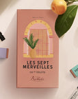 Bastide Les Sept Merveilles Fragrance Discovery Set lifestyle shot showing tangerine branches and fruit and some of the fragrances