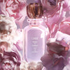 Oribe Valley Of Flowers Eau de Parfum Beauty shot among flowers