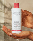 Christophe Robin Regenerating Shampoo with Prickly Pear Oil in model's hands under running water