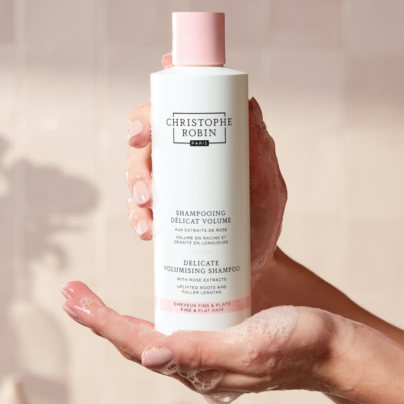 Christophe Robin Delicate Volume Shampoo with Rose Extracts in model&#39;s hands