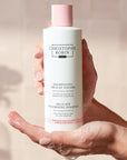 Christophe Robin Delicate Volume Shampoo with Rose Extracts in model's hands