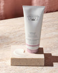Christophe Robin Delicate Volume Conditioner with Rose Extracts showing tube beside a smear of product