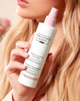 Christophe Robin Instant Volume Mist with Rose Extracts shown in model's hand