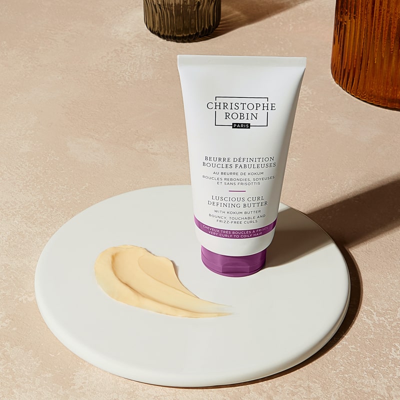 Christophe Robin Luscious Curl Defining Butter showing tube on a plate with product smear