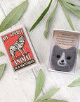 Marvling Bros Ltd My Spirit Animal Wool Felt Wolf In a Matchbox showing open box and lid with leaves in background