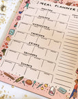 Abbie Ren Illustration Meal Planner Notepad shown at an angle