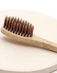 OJOOK Intention Setting Toothbrush showing close-up of brush head