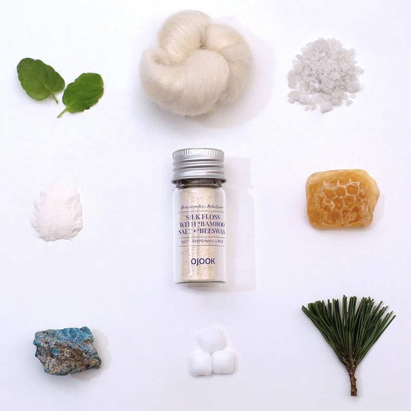OJOOK Silk Floss with Bamboo Salt and Beeswax shown with key ingredients