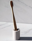 OJOOK Toothbrush Holder shown with toothbrush in it (sold separately)