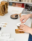 Studio Carta Le Piccole Scissors - showing model removing scissors from tin