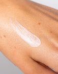 Smear of Ursa Major Forest Alchemy Eye Cream on back of hand