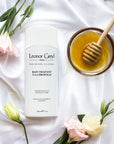 Leonor Greyl Bain Traitant A La Propolis – Gentle Dandruff Treatment Shampoo Pictured With Flowers and Honey 