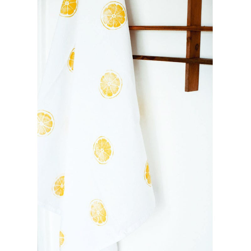 Kelsi Cross Studios Printed Tea Towel – Lemon Block - hanging from rack - looks more orange than yellow
