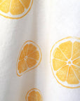 Kelsi Cross Studios Printed Tea Towel – Lemon Block - closeup of imprint - looks more orange than yellow