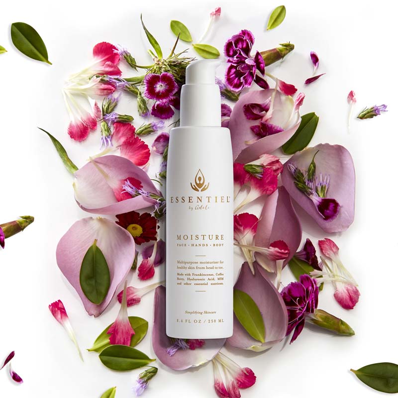 Essentiel Moisture Beauty shot with flower petals and leaves