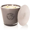 Parfums de Nicolai Maharadjah Candle shown with lid to the side and all 3 wicks lit