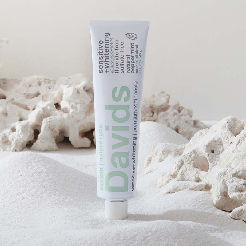 Davids Premium Toothpaste - Sensitive + Whitening Nano-Hydroxyapatite beauty shot in front of salt 