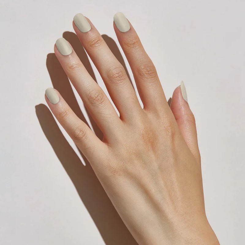 Hand of model wearing JINsoon x Suzie Kondi Nail Lacquer – Piedra