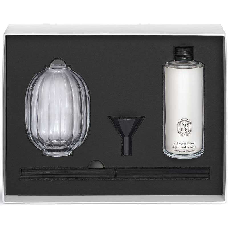 Diptyque Roses Home Fragrance Diffuser showing box open with diffuser bottle, fragrance container, funnel and reeds in box