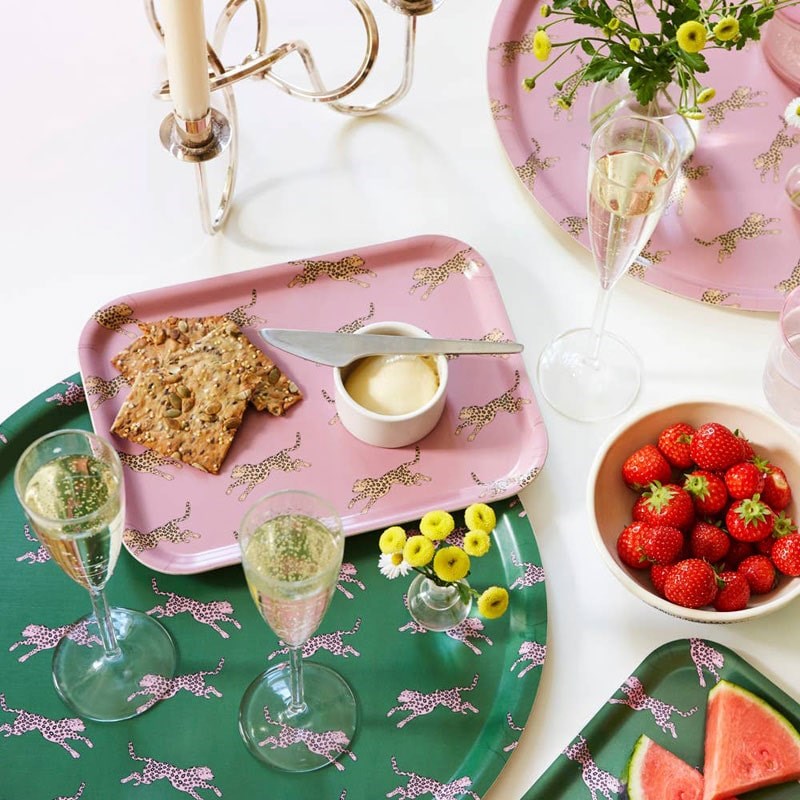 Blu Kat Pink Leopard Round Serving Tray - lifestyle shot showing this tray and another tray (not included) on it.