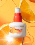 HoliFrog Sunnyside C Glow Serum showing with orange slices and serum