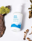 Ursa Major Making Moves Milky Cleanser showing with leaves, plants and wood