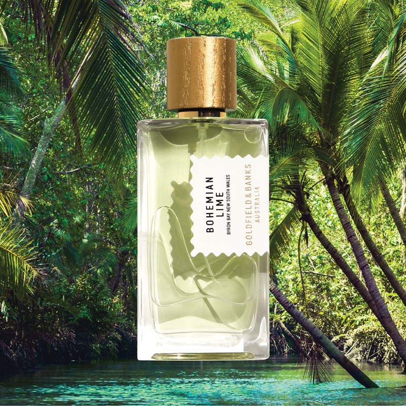 Mood shot of Goldfield &amp; Banks Bohemian Lime Perfume 100 ml with water and palm trees in the background