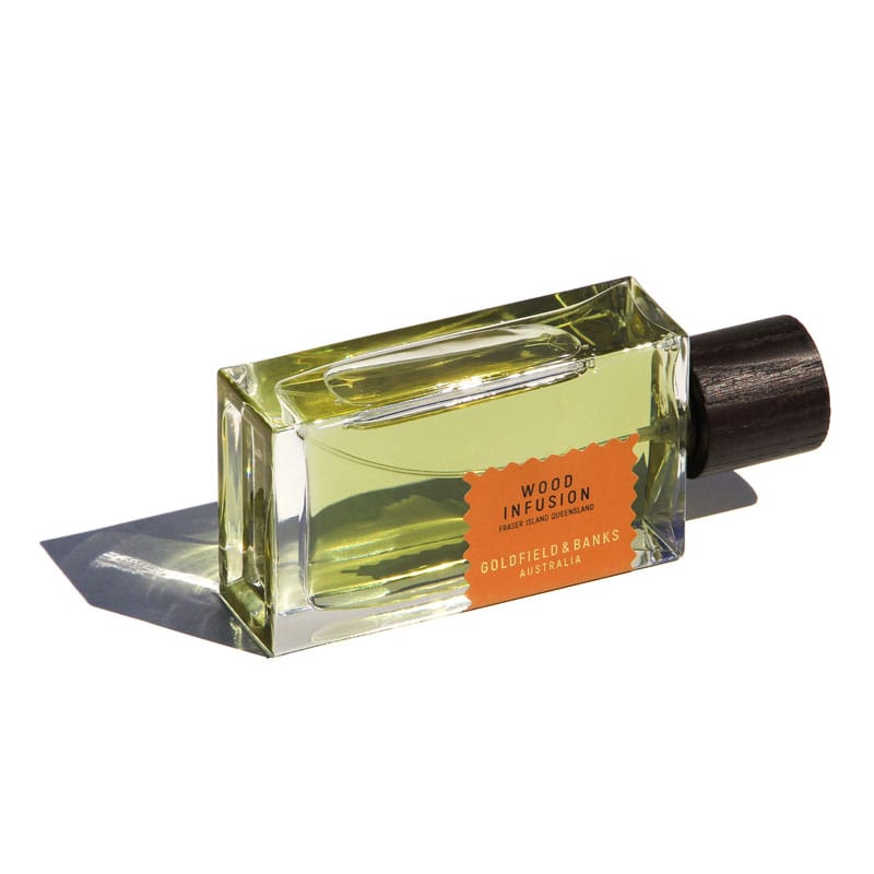Goldfield &amp; Banks Wood Infusion Perfume laying on its side