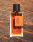 Mood shot of Goldfield & Banks Desert Rosewood Perfume 100 ml with desert landscape in the background