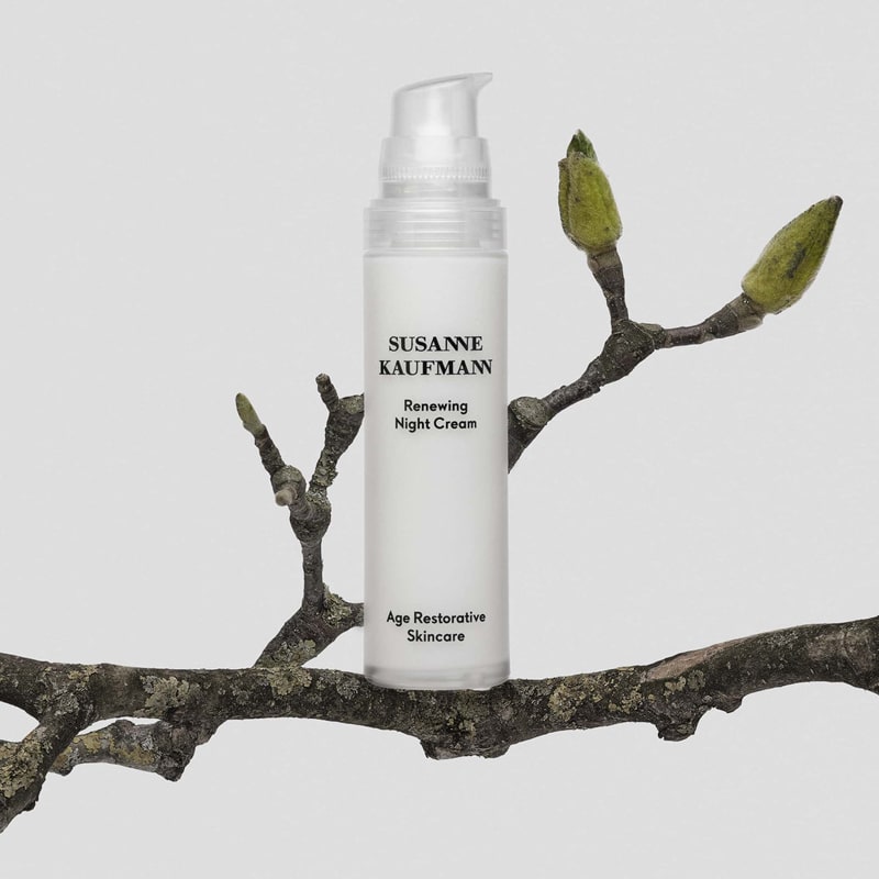 Lifestyle shot of Susanne Kaufmann Renewing Night Cream (50 ml) sitting on branch